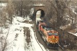 Eastbound stack train pops out of the tunnel